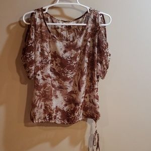 Sheer top with should cut outs.